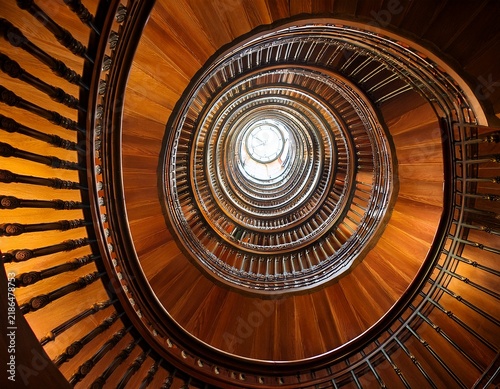 spiral staircase with warm rich tones