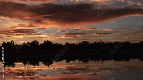 Beautiful Sunrise over Water Timelapse Zoom Out
