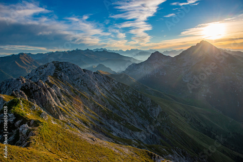 Mountain peaks at sunset with a fiery sky