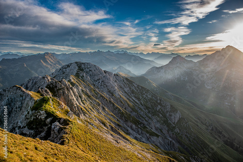 Mountain peaks at sunset with a fiery sky
