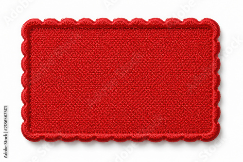 Blank red fabric patch with stitched border for branding or labeling on transparent background