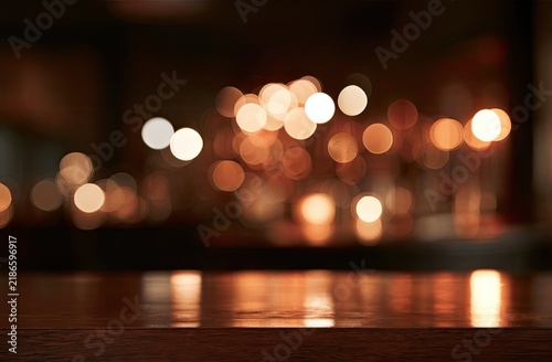 Warm, glowing bokeh lights create an intimate, inviting atmosphere
