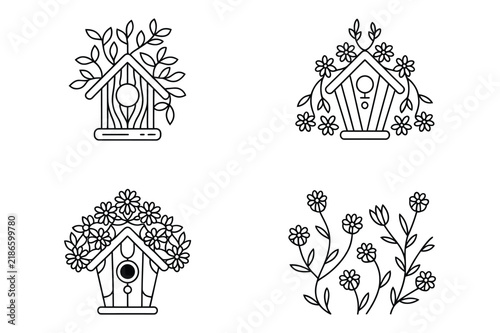 Wooden birdhouse structures decorated with summer blooming garden flowers