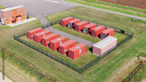Aerial view on battery energy storage system. Industrial lithium batteries facility for clean electricity grid management and sustainable technology infrastructure.