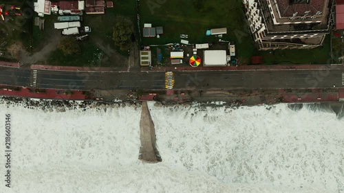 Seafront road buildings destroyed by climate change, furious ocean waves