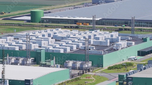Aerial drone view of modern data center building, technology infrastructure with servers, cloud network and digital storage facility, industrial complex from above.