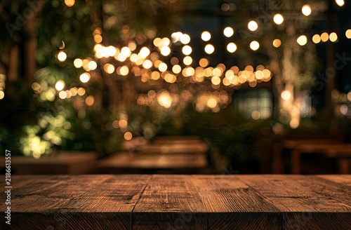 Warm string lights illuminate a rustic outdoor seating area at night
