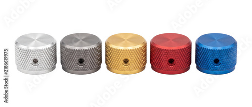 Metal knurled rotary control knobs in multiple colors lined up on black background, anodized aluminum potentiometer volume dials for audio equipment, industrial hardware components and dial interface.