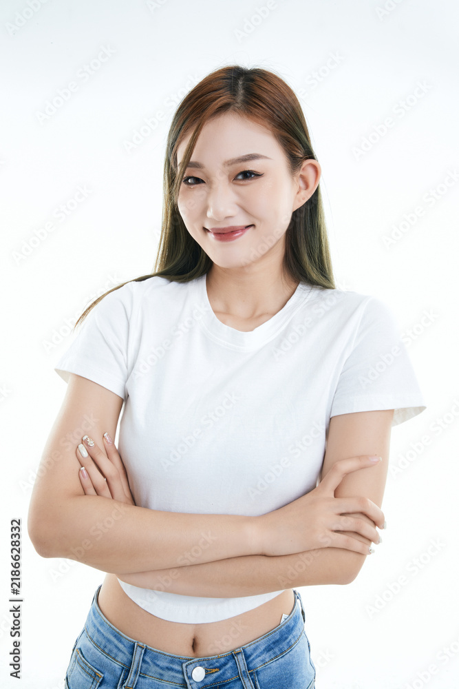 Fototapeta premium Cute and lively Asian girl against a white background