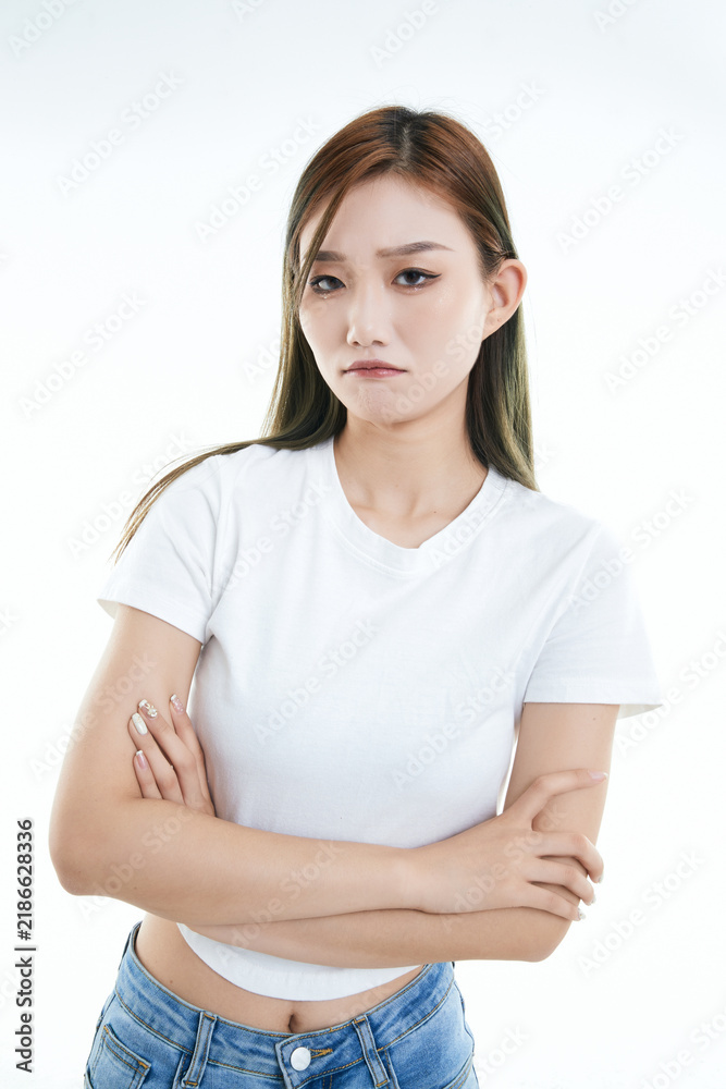 Fototapeta premium Cute and lively Asian girl against a white background