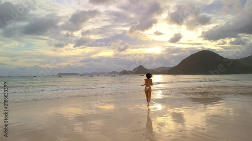 Selong Belanak Beach Sunset: Woman Walking on Shore