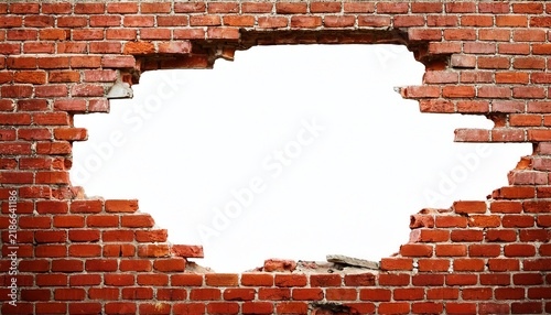 destroyed wall with a red brick hole in the middle isolated on white background vertical frame grunge frame high quality photo
