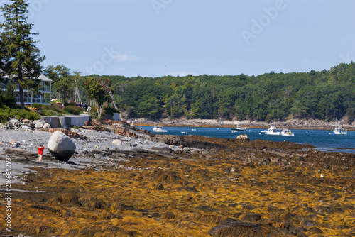 Obraz na płótnie Person standing beside Balance Rock along the historic Shore Path in Bar Harbor,