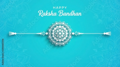 Blue mandala background with elegant rakhi for festival greeting