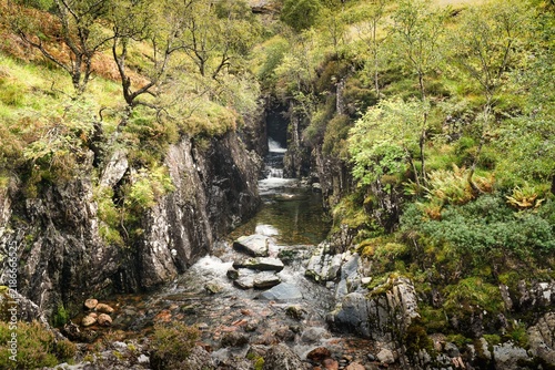 Waterfall on River Coe during autumn at Glencoe National Nature Reserve in Ballachulish, Scotland, UK