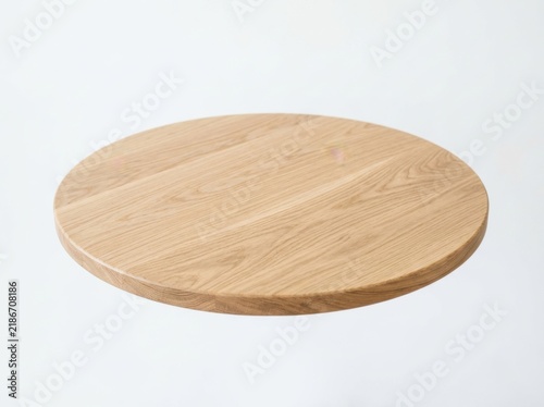 Round wooden cutting board isolated on a white background