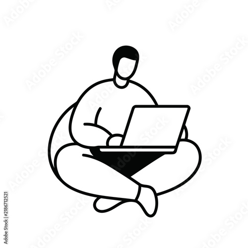 Person sitting cross-legged with laptop