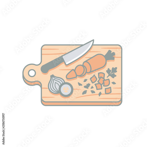 Cutting board with knife and chopped vegetables.