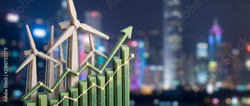 Green energy growth concept with wind turbines and rising financial bar chart against blurred city night background, symbolizing sustainable development and clean power investment success.