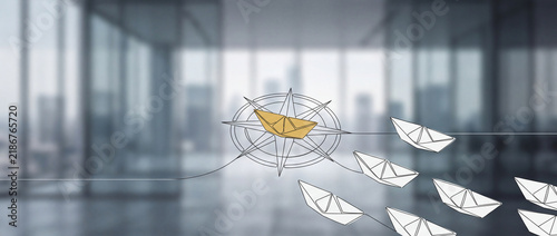 Conceptual leadership visual showing a gold paper boat leading a fleet on a compass rose against a blurred office background, symbolizing strategic business vision and guidance.
