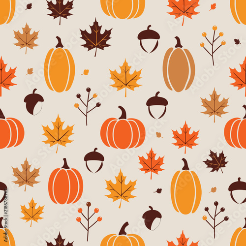 Autumn seamless pattern with orange pumpkins and maple leaves. Fall harvest background with acorns and berries. Seasonal vector wallpaper.
