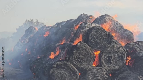 Fire in a village. Hay bales.