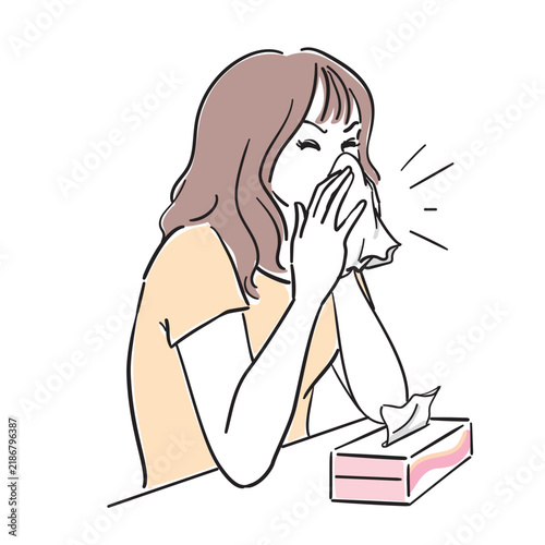 鼻をかむ女性　風邪花粉症の症状