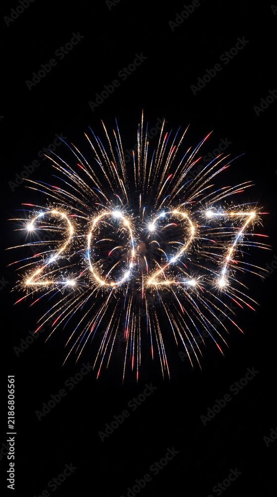 Obraz premium Front view of sparkling blue and red 2027 fireworks in darkness