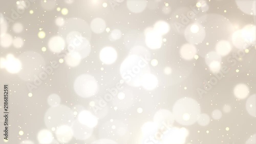 シルバーホワイト背景に舞い散る美しい玉ボケと輝く光の粒子のシームレスループ動画素材 / Glowing bokeh and shining light particles loop on silver white gradient background