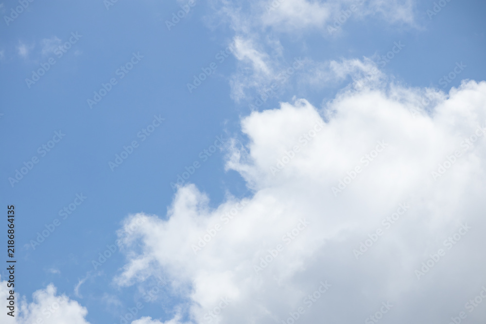 Fototapeta premium Beautiful blue sky with white clouds on a sunny day background