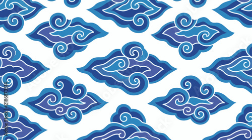 Seamless pattern featuring traditional Indonesian batik Mega Mendung motif with stylized blue and white clouds.