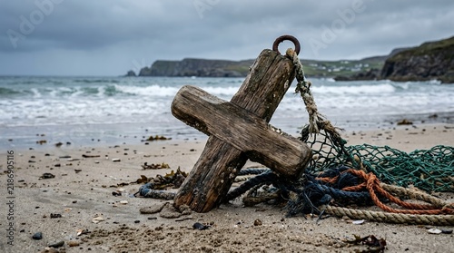 Weathered Wooden Cross and Fishing Net Washed Ashore on a Sandy Beach.