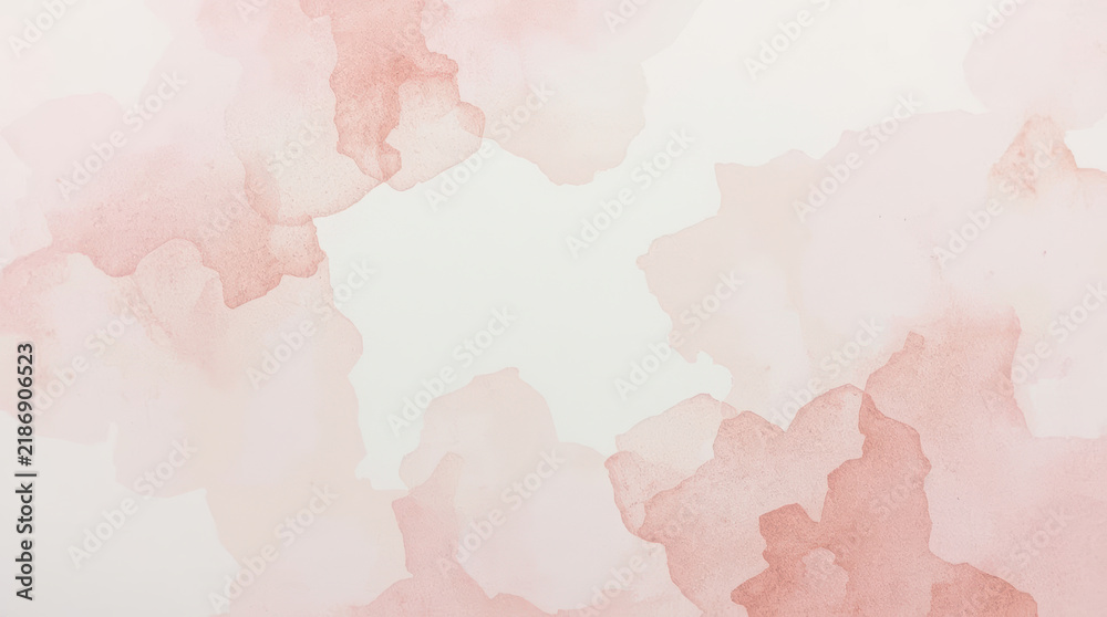 Obraz premium Soft pink watercolor paper background with subtle pigment bloom and delicate abstract wash, creating gentle airy texture for elegant design