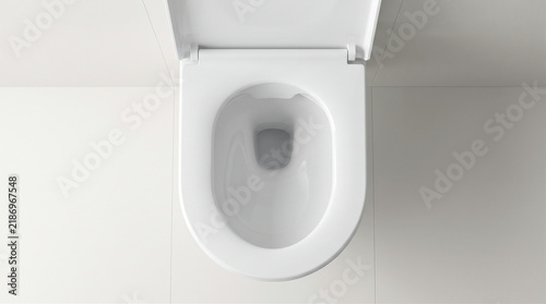 Top view of a clean white ceramic toilet bowl with the lid open in a modern minimalist bathroom