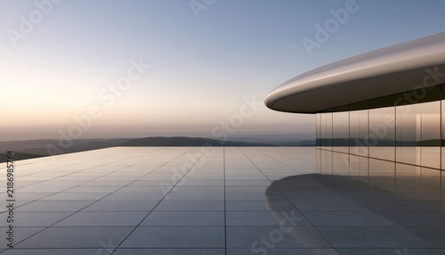 Modern Architectural Building with Reflective Surface at Sunset.