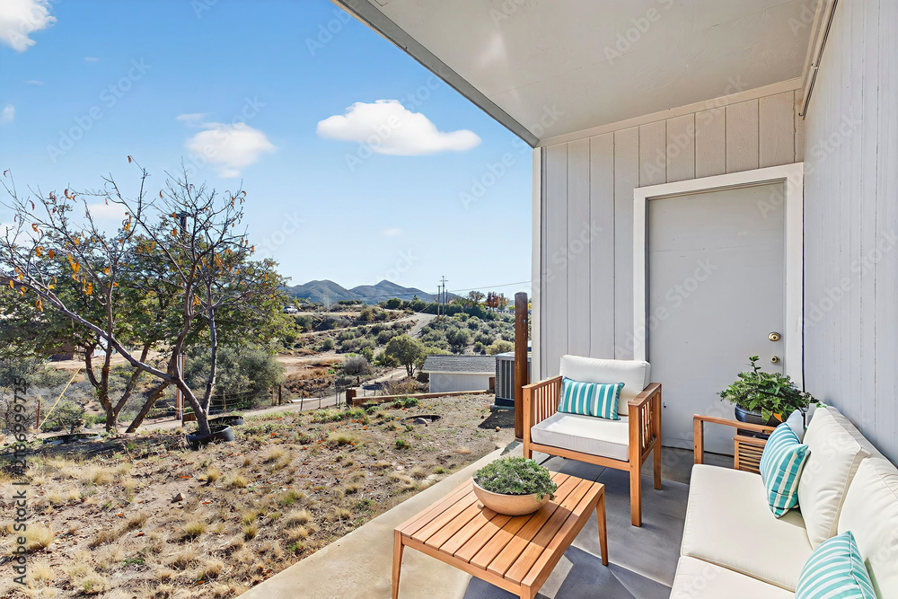 Obraz premium Cozy balcony seating with hillside view and sunny terrace