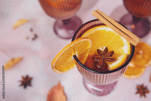 Canvastavla White mulled wine with orange slices and cinnamon sticks in a glass