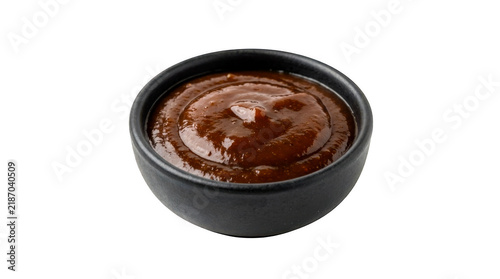 Foto Small black bowl filled with delicious brown barbecue sauce isolated on transpar
