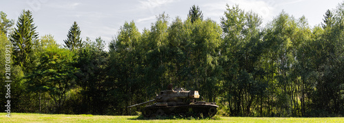 a broken rusting tank in the nature panorama