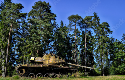 a broken rusting tank in the nature