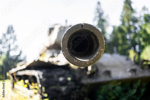 a old tank with a pointing gun