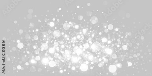 Obraz na płótnie A collection of glowing white bokeh lights scattered across a black background