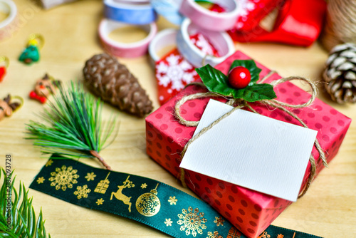 Preparing a red polka dot Christmas gift box
