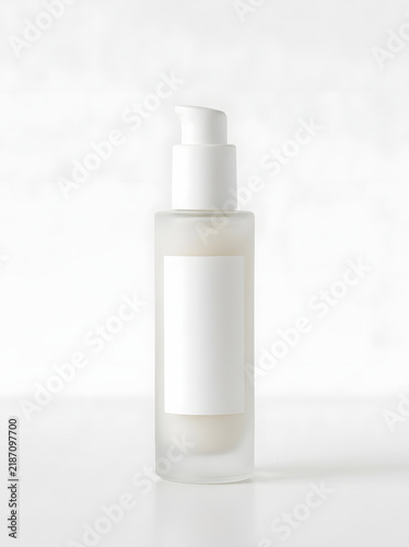 Empty white cosmetic pump bottle for skincare or beauty products
