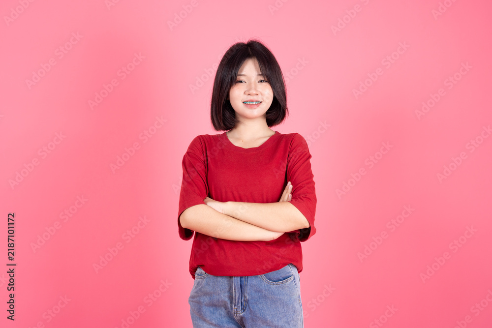 Obraz premium Asian Thai Student casual cute teen girl lovely portrait studio shot isolate on pink background.