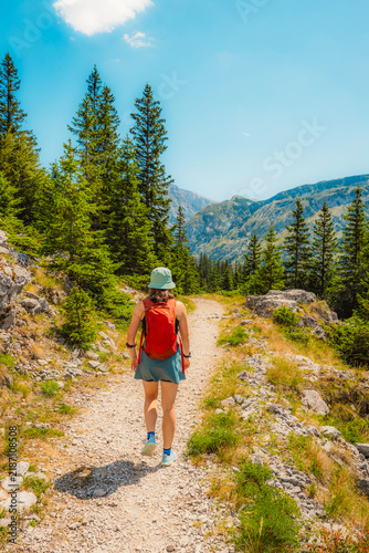 Alpine hiking trail from Prijevor in Bosnia to Trnovacko Lake in Montenegro, dramatic Dinaric Alps in Sutjeska park landscapes and crystal clear turquoise water.
