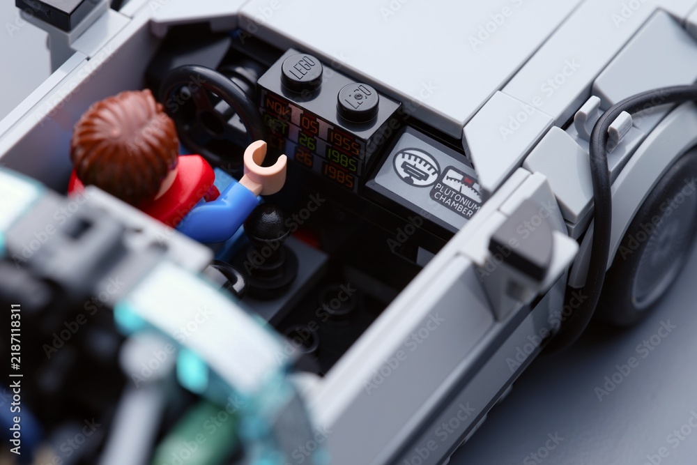 Fototapeta premium Tambov, Russian Federation - July 12, 2026 A close-up of a Lego Marty McFly minifigure sitting inside the DeLorean time machine car with visible time circuits. Back to the Future.