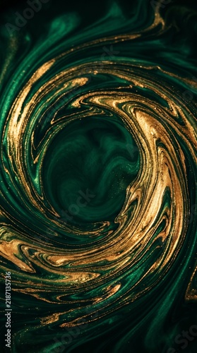 Abstract swirling pattern of deep emerald green and shimmering gold liquid creating a captivating vortex design.