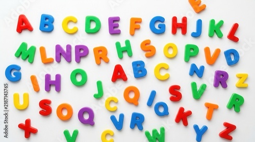 A white surface with bright letter magnets arranged on it