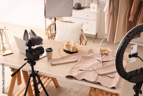 Bloggers workplace with laptop and stylish accessories in studio